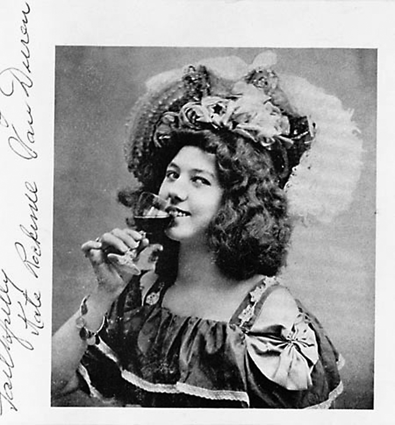Klondike Kate with wine glass